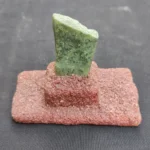 Close-up image of green Chrysoprase gemstone showing vivid color and natural texture