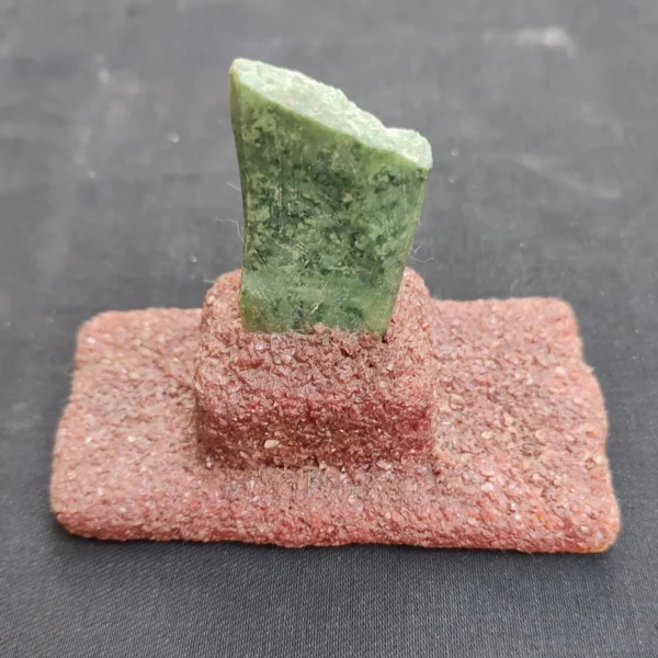 Close-up image of green Chrysoprase gemstone showing vivid color and natural texture