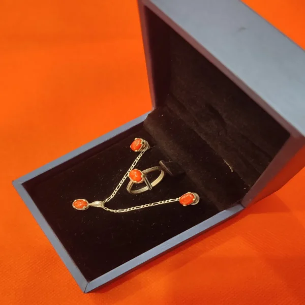 Necklace, ring, and earrings set with Marjan coral stone in silver