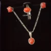 Close-up of Marjan red coral stones in a handmade silver jewellery set