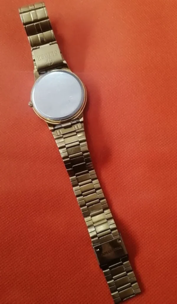 Underside view of SLIDER Watch showing metal bracelet and deployment clasp