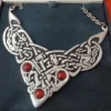 Close-up of handmade pewter Celtic triangle necklace by St. Justin